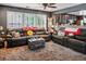 Inviting living room features plush seating, soft carpet, and seamless flow to kitchen at 8884 Perfect Diamond Ct, Las Vegas, NV 89129