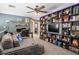 Comfortable living space with desk and a large wooden bookcase, perfect for relaxation and work at 8884 Perfect Diamond Ct, Las Vegas, NV 89129