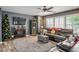 Cozy living room with fireplace, TV, and neutral paint is perfect for relaxing at 8884 Perfect Diamond Ct, Las Vegas, NV 89129