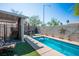 Outdoor pool features patio seating, lush landscaping, and privacy walls at 8884 Perfect Diamond Ct, Las Vegas, NV 89129