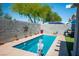 Private backyard pool surrounded by charming patio, perfect for relaxation and outdoor entertaining at 8884 Perfect Diamond Ct, Las Vegas, NV 89129