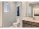 Well-lit bathroom with a sleek vanity, modern fixtures, and a minimalist design at 9588 Archer Peak Ct, Las Vegas, NV 89143