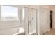 Modern bathroom features glass shower enclosure, soaking tub, and great lighting at 9588 Archer Peak Ct, Las Vegas, NV 89143