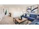 Stylish living room features modern furniture, a patterned wood coffee table, and neutral decor at 9588 Archer Peak Ct, Las Vegas, NV 89143