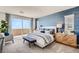 Relaxing main bedroom with accent wall, comfortable seating, and access to outdoor patio at 9588 Archer Peak Ct, Las Vegas, NV 89143