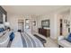 Spacious main bedroom with closet access, private balcony, and comfortable seating at 9588 Archer Peak Ct, Las Vegas, NV 89143