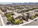 Expansive aerial view of a residential neighborhood with homes, streets, and the scenic mountains in the distance at 9655 Skye Star Ave, Las Vegas, NV 89166