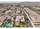 Overhead view capturing houses with solar panels, streets, and neighborhood landscaping at 9655 Skye Star Ave, Las Vegas, NV 89166