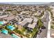 Aerial view of a residential community with houses, swimming pools, and well-kept landscaping at 9655 Skye Star Ave, Las Vegas, NV 89166
