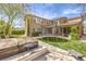 Backyard showcasing a trampoline, hot tub, and patio with lush landscaping at 9655 Skye Star Ave, Las Vegas, NV 89166