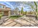 Backyard featuring a hot tub, trampoline, and walkway to a covered patio at 9655 Skye Star Ave, Las Vegas, NV 89166