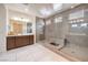 Modern bathroom with double walk-in showers, tile floors, and contemporary fixtures at 9655 Skye Star Ave, Las Vegas, NV 89166