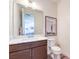 Modern powder room featuring a sleek vanity, framed mirror, and contemporary fixtures at 9655 Skye Star Ave, Las Vegas, NV 89166