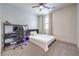 Cozy bedroom with a comfortable bed, functional desk, and soft natural light at 9655 Skye Star Ave, Las Vegas, NV 89166