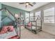Charming bedroom with whimsical beds, bright green wall, and natural light at 9655 Skye Star Ave, Las Vegas, NV 89166