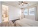 Well-lit bedroom with ensuite bathroom and large windows, creating a bright and inviting space at 9655 Skye Star Ave, Las Vegas, NV 89166