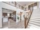 Grand foyer featuring staircase with modern railings, high ceilings, and an open floor plan at 9655 Skye Star Ave, Las Vegas, NV 89166