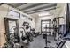 Home gym in garage featuring work out equipment, mirrored wall and a window at 9655 Skye Star Ave, Las Vegas, NV 89166