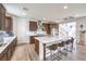 Open kitchen featuring stainless steel appliances, a large island with seating, and modern finishes at 9655 Skye Star Ave, Las Vegas, NV 89166