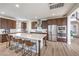 Spacious kitchen with large island, stainless steel appliances, and dark wood cabinets at 9655 Skye Star Ave, Las Vegas, NV 89166