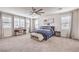 Bright main bedroom with natural light, ceiling fan, and comfortable furnishings at 9655 Skye Star Ave, Las Vegas, NV 89166