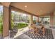 Relaxing patio and backyard featuring an outdoor dining area and a trampoline at 9655 Skye Star Ave, Las Vegas, NV 89166