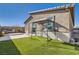 Backyard with artificial turf, a patio area, and a gazebo at 9698 Pacific Pine St, Las Vegas, NV 89143