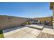 Backyard patio featuring outdoor seating, a grill, block wall and pavers at 9698 Pacific Pine St, Las Vegas, NV 89143