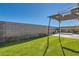 Backyard featuring artificial turf, a patio area, a gazebo, and a block wall at 9698 Pacific Pine St, Las Vegas, NV 89143