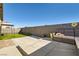 Backyard with patio featuring outdoor seating and an artificial turf area at 9698 Pacific Pine St, Las Vegas, NV 89143
