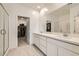 Bathroom featuring a large double vanity with white countertops and modern finishes at 9698 Pacific Pine St, Las Vegas, NV 89143