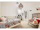 Nicely decorated bedroom with plush chair, decorative bed, and plenty of natural light at 9698 Pacific Pine St, Las Vegas, NV 89143