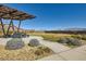 Community park area with landscaping, walking path, and mountain views at 9698 Pacific Pine St, Las Vegas, NV 89143