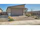A cozy single-Gathering home with a brick driveway and meticulously manicured desert landscaping at 9698 Pacific Pine St, Las Vegas, NV 89143