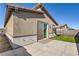 Exterior view of the back of the home, featuring a patio and artificial turf at 9698 Pacific Pine St, Las Vegas, NV 89143