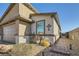 Beautifully landscaped front yard highlighting a home's architectural details and charming walkway at 9698 Pacific Pine St, Las Vegas, NV 89143