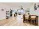 Bright living area with sleek floors, fan, sliding glass doors, and access to a bedroom at 9698 Pacific Pine St, Las Vegas, NV 89143