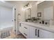 Bright bathroom featuring double sinks, modern fixtures, and a separate toilet room at 9705 Standard Ave, Las Vegas, NV 89129