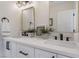 Stylish bathroom with double sinks, modern fixtures, and decorative lighting at 9705 Standard Ave, Las Vegas, NV 89129