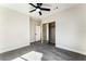 Neutral bedroom featuring carpeted floors, ceiling fan, and mirrored closet doors at 9705 Standard Ave, Las Vegas, NV 89129