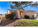 Charming single-story home featuring desert landscaping, an inviting entrance, and well-manicured bushes at 9705 Standard Ave, Las Vegas, NV 89129