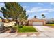 Charming single-story home featuring a well-maintained lawn, desert landscaping, and a two-car garage at 9705 Standard Ave, Las Vegas, NV 89129