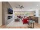 Spacious living room featuring modern fireplace, hardwood floors, and a comfortable seating area at 9705 Standard Ave, Las Vegas, NV 89129