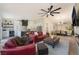 Open-concept living room with a ceiling fan, recessed lights, and modern furnishings at 9705 Standard Ave, Las Vegas, NV 89129