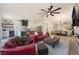 Open-concept living room with a ceiling fan, recessed lights, and modern furnishings at 9705 Standard Ave, Las Vegas, NV 89129