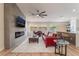 Spacious living room featuring modern fireplace, hardwood floors, and a comfortable seating area at 9705 Standard Ave, Las Vegas, NV 89129