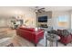 Bright living room features a modern fireplace, hardwood floors, and a comfortable seating area at 9705 Standard Ave, Las Vegas, NV 89129