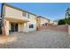 Gravel backyard featuring a covered patio, and block wall, providing a private outdoor space at 9846 Sunriver Meadows Ave, Las Vegas, NV 89148