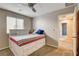 Bedroom with plush carpet and a view of the hallway and an adjacent bathroom at 9846 Sunriver Meadows Ave, Las Vegas, NV 89148