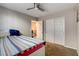 Bedroom with plush carpet and a bed in view of the hallway and closet at 9846 Sunriver Meadows Ave, Las Vegas, NV 89148